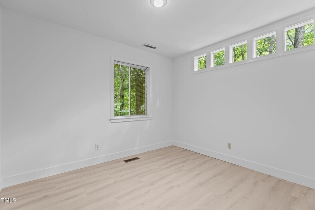 A bedroom with clerestory windows in a mid century modern house in durham north carolina
