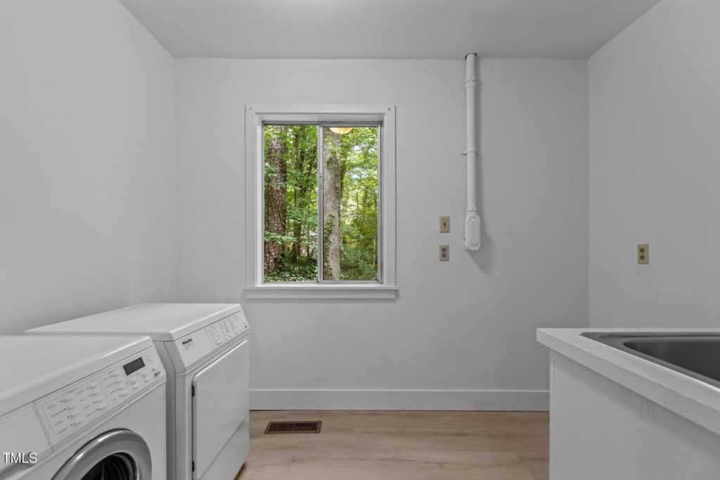A basement laundry room in a mid century modern house in durham north carolina
