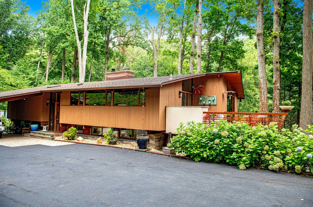 Towson Maryland mid‑century 1970s Acorn Deck House exterior among mature trees