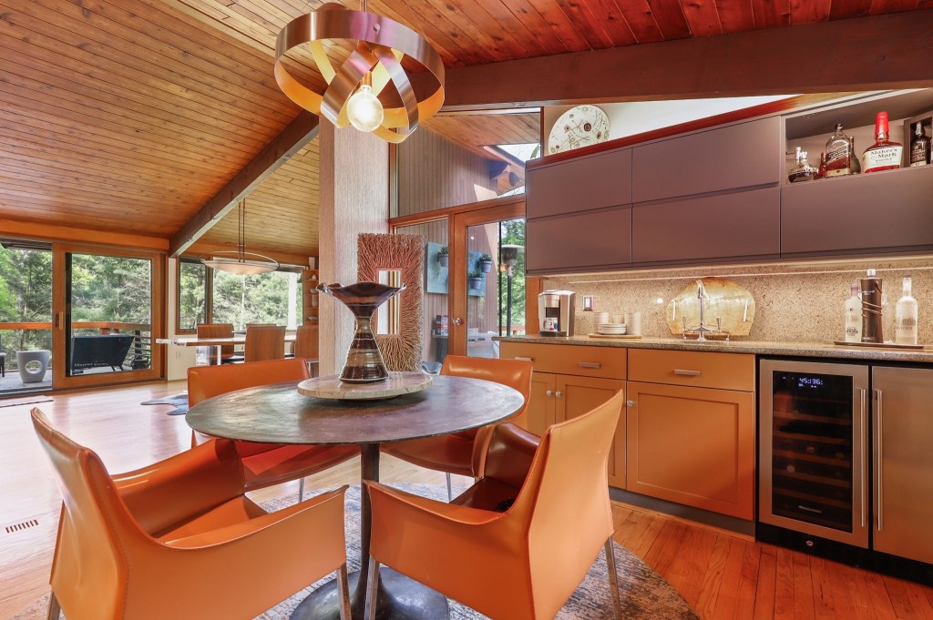 Mid-century coffee bar with original cabinetry and natural wood tones

