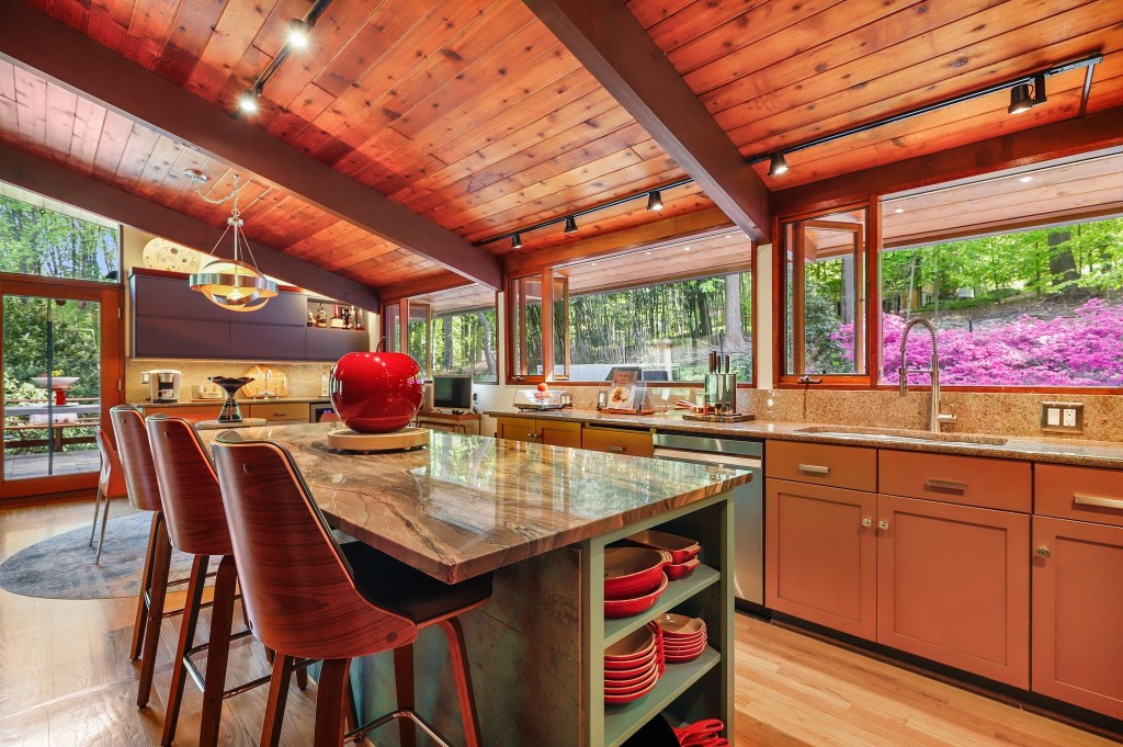 Mid-century retro kitchen with warm cabinetry and natural wood tones and clerestory windows in Baltimore Maryland

