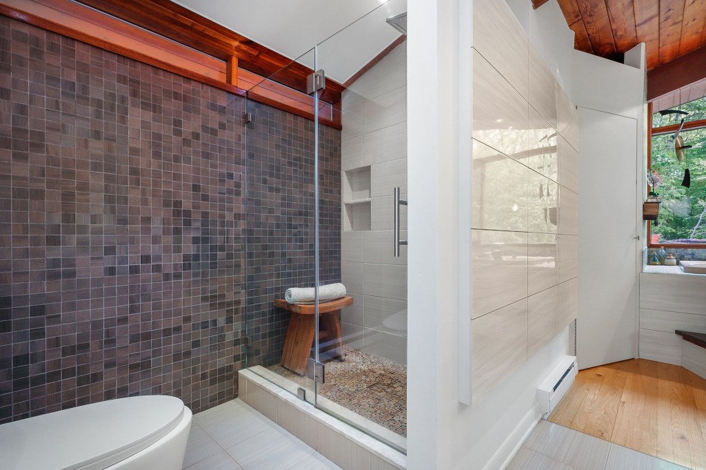 Vintage mid-century bathroom with grey tile wall in the shower