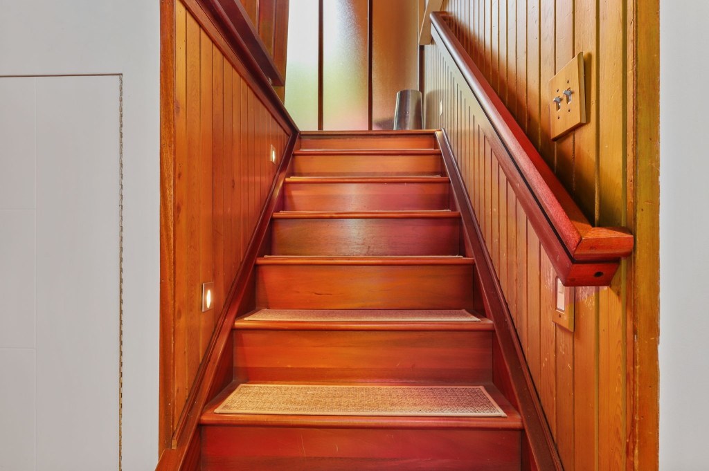 Mid century modern half staircase in acorn deck house