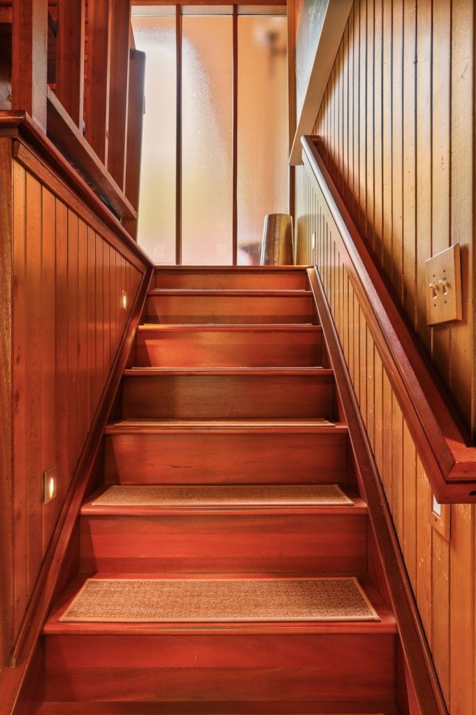 Mid century modern half staircase in acorn deck house