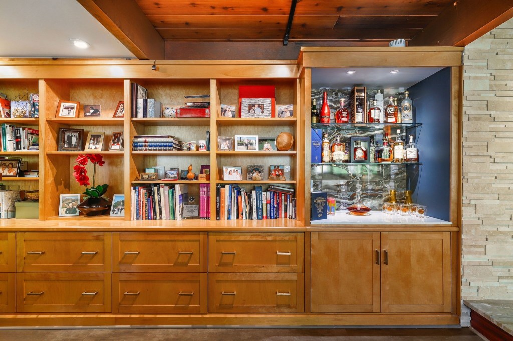 Large wooden built in bookshelves