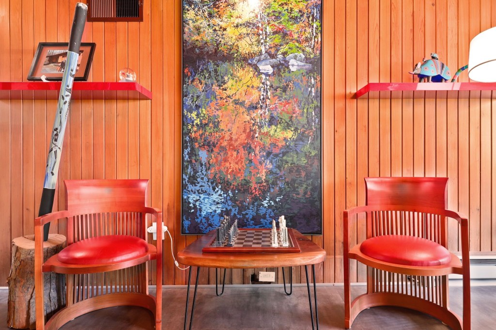 room with woodl paneling in mid century modern deck house