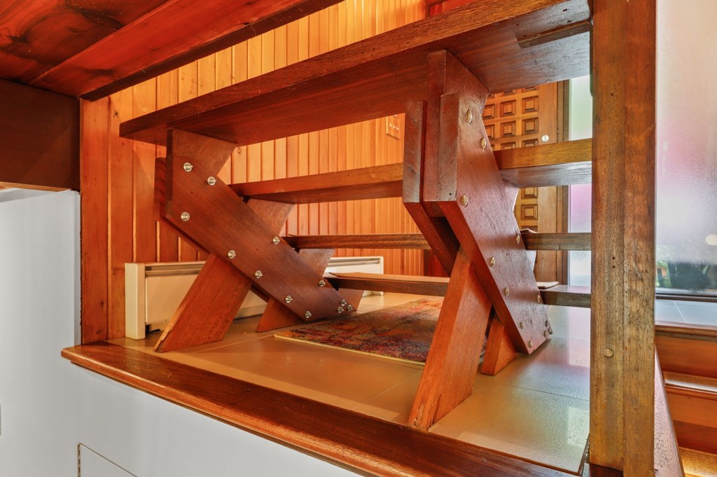 Mid century modern half staircase in acorn deck house