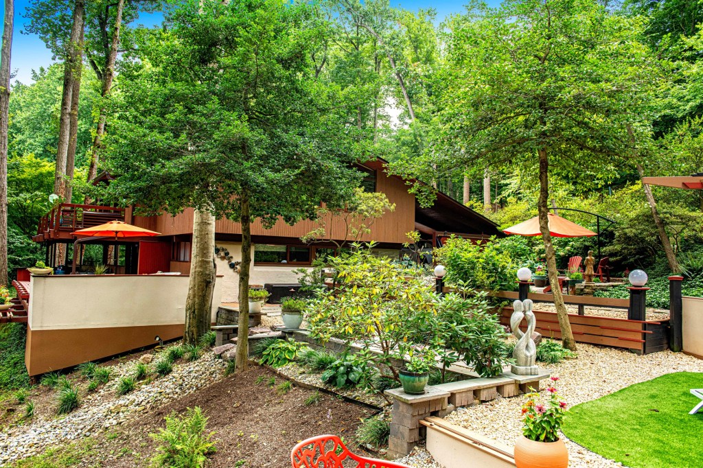 Lush garden views from elevated deck of Towson mid-century modern home

