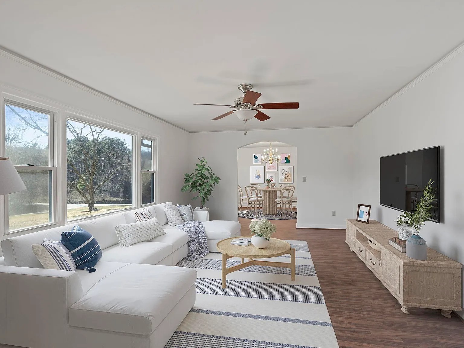 Bright and spacious living room with hardwood floors and natural light in Travelers Rest home

