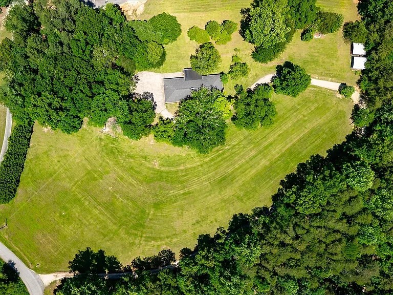 Peaceful Travelers Rest home surrounded by mature trees on five private acres