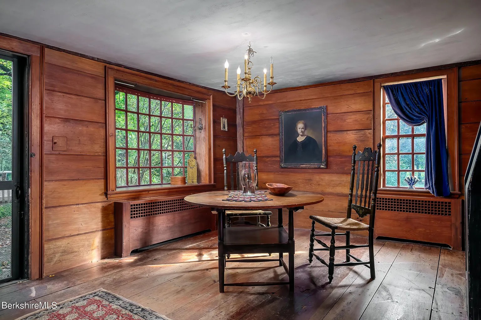 Sitting room in dark grey restored 18th-century Georgian home in Williamstown Massachusetts