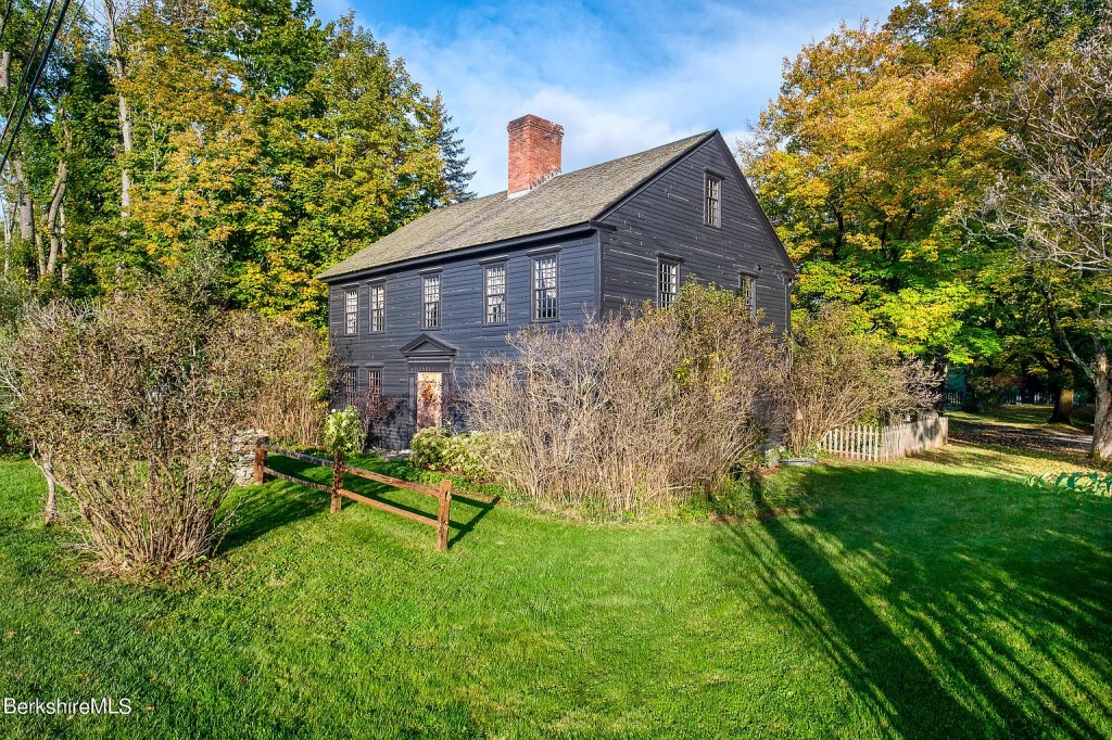 Dark Grey 18th-century Georgian home in Williamstown Massachusetts with a nice yard