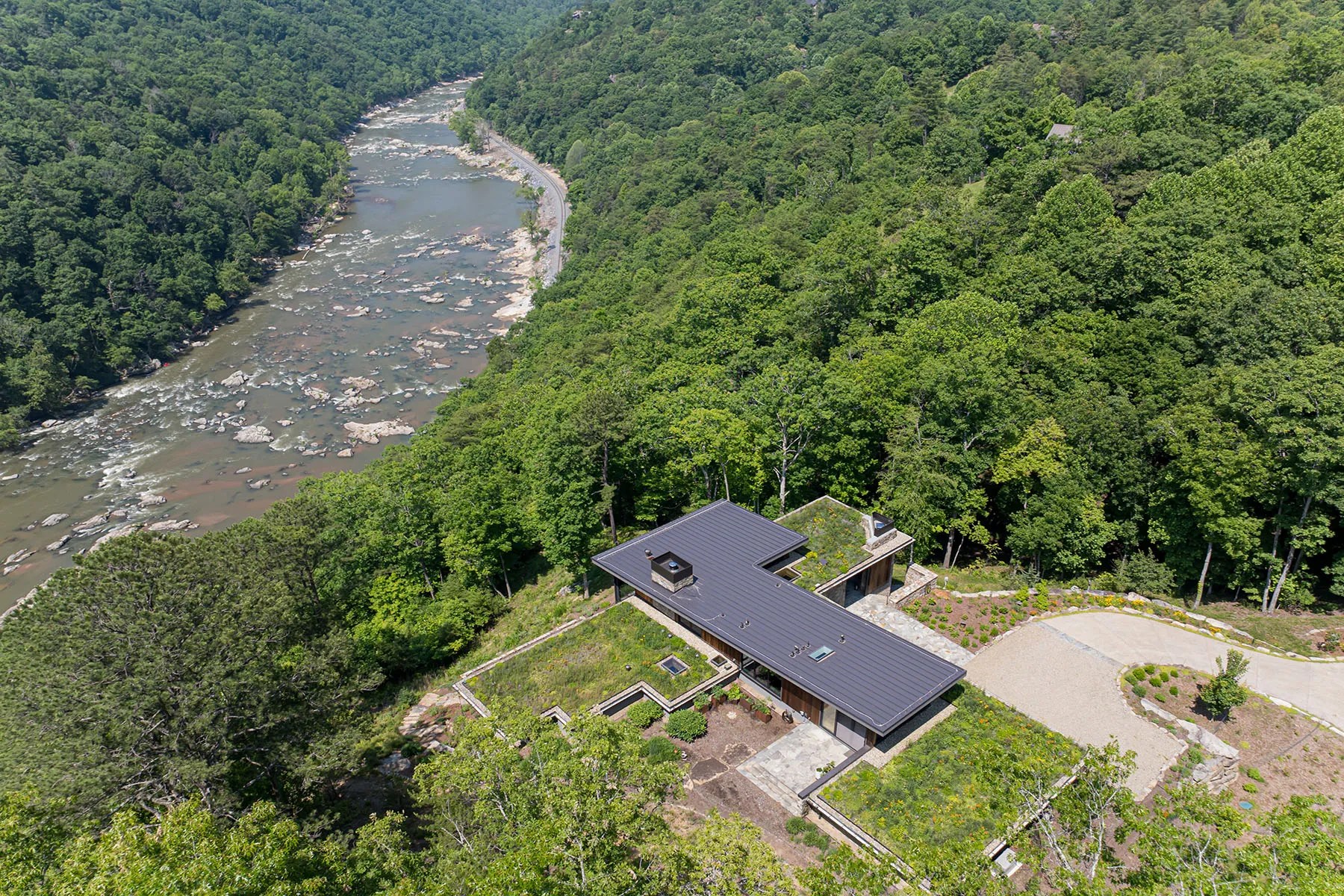Modern home with green living roof nestled in the mountains near the French Broad River

