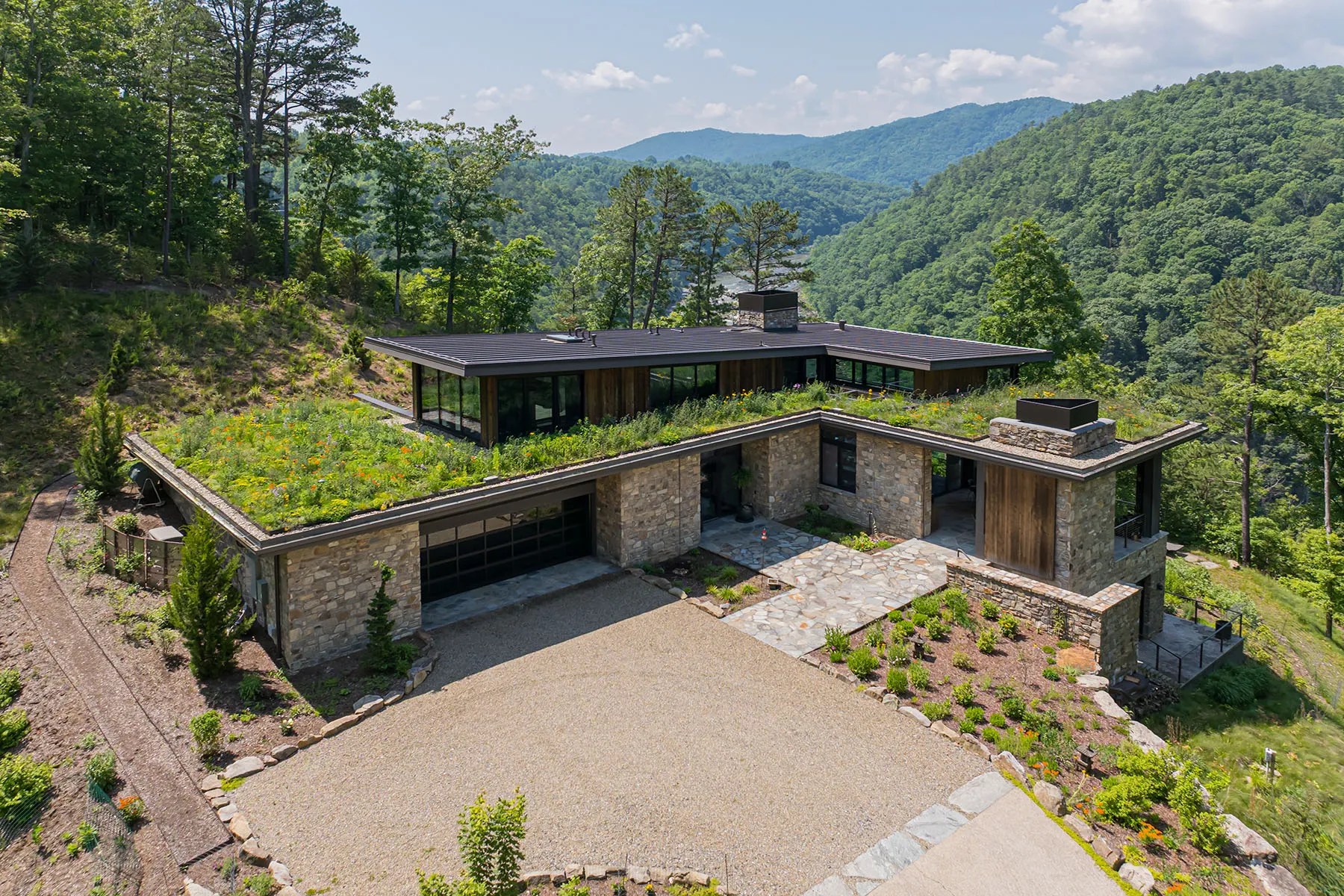 Modern home with green living roof nestled in the mountains near the French Broad River

