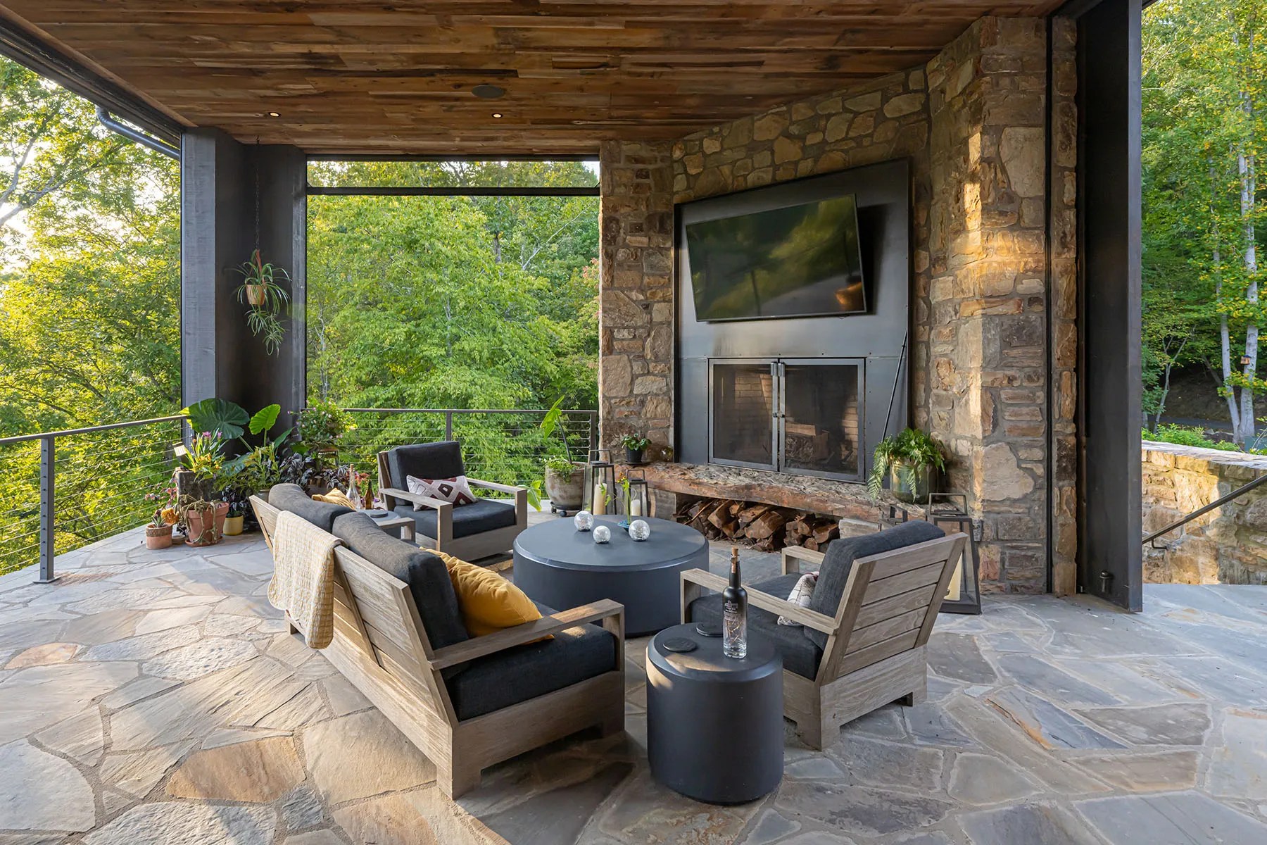 Covered patio area offering peaceful views of the forest and energy-efficient design features

