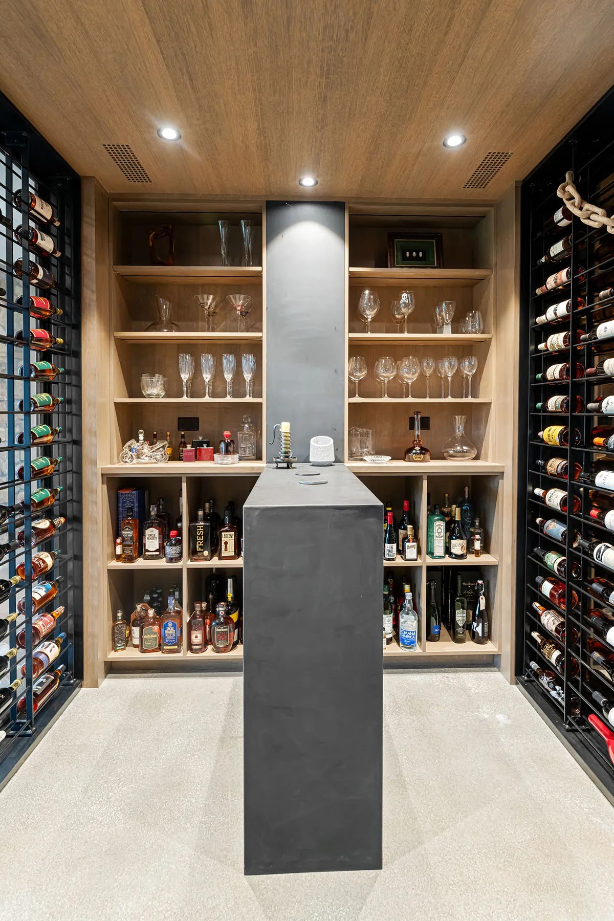 Wine cellar room in a sustainable house with glass walls