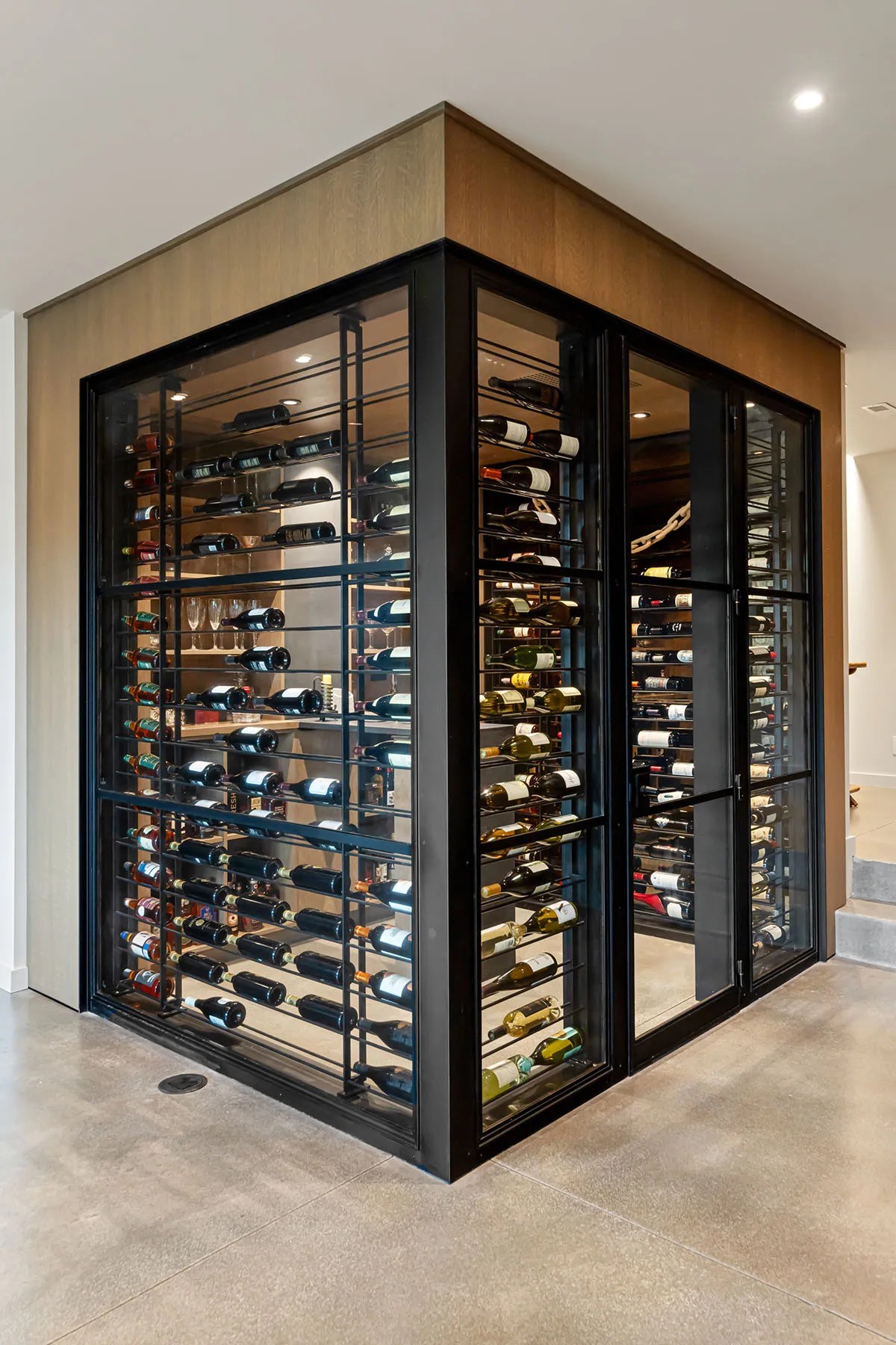 Wine cellar room in a sustainable house with glass walls